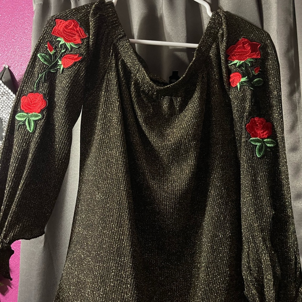 Black with green glitter off the should shirt with rose detailing